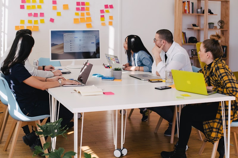 Consultant coaching a manufacturing team — SMP's capability transfer that outlasts the engagement
